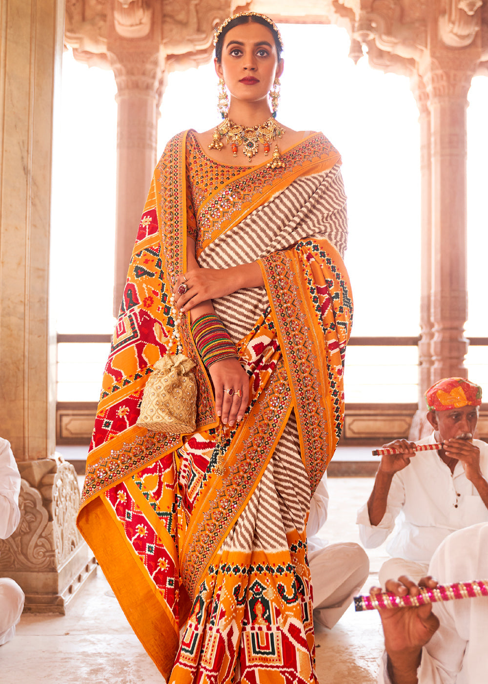 Porsche Yellow and White Woven Patola Saree