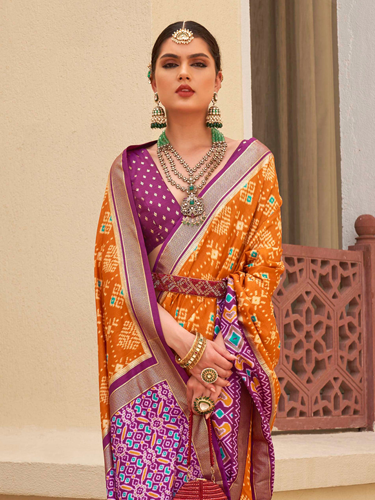 Hot Cinnamon Orange and Purple Printed Patola Soft Silk Saree