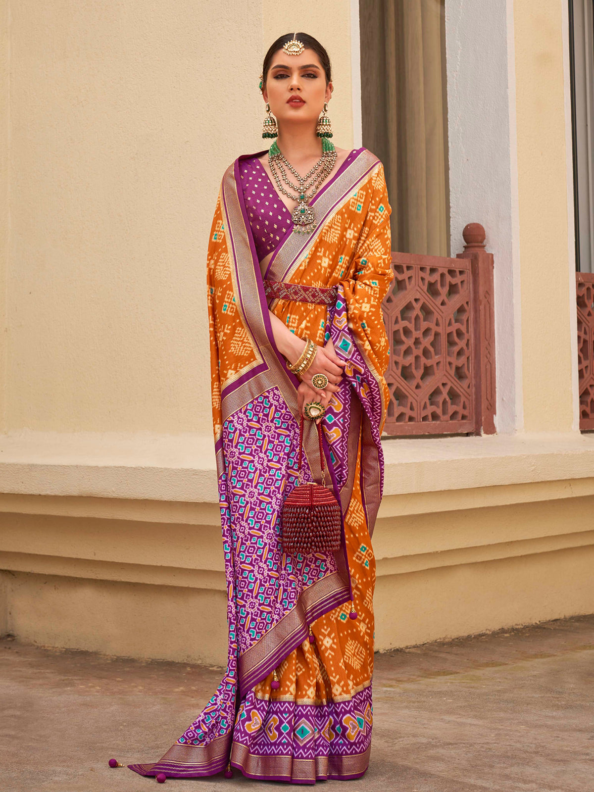 Hot Cinnamon Orange and Purple Printed Patola Soft Silk Saree