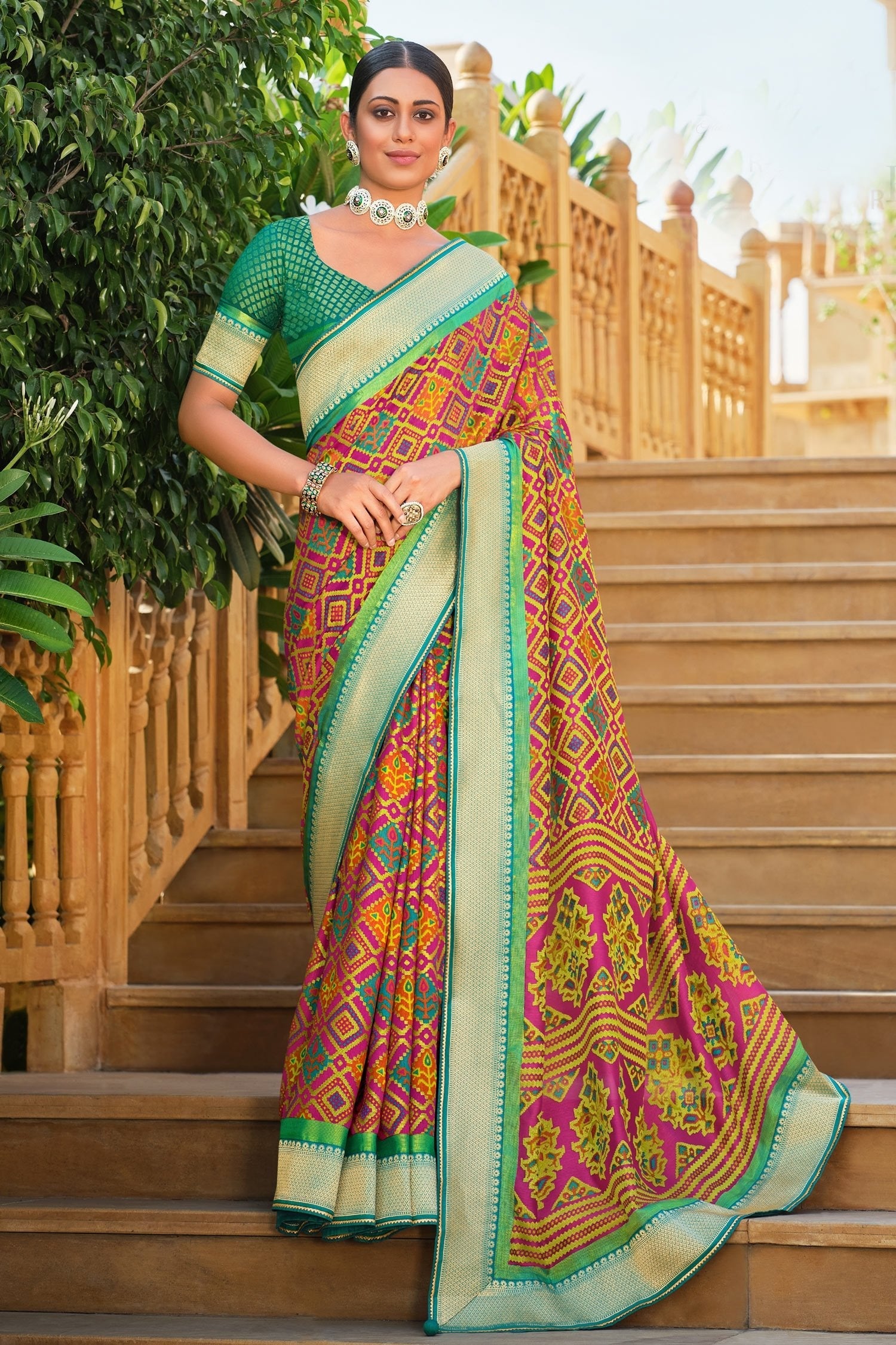 Alpine Orange Brasso Patola Printed Saree