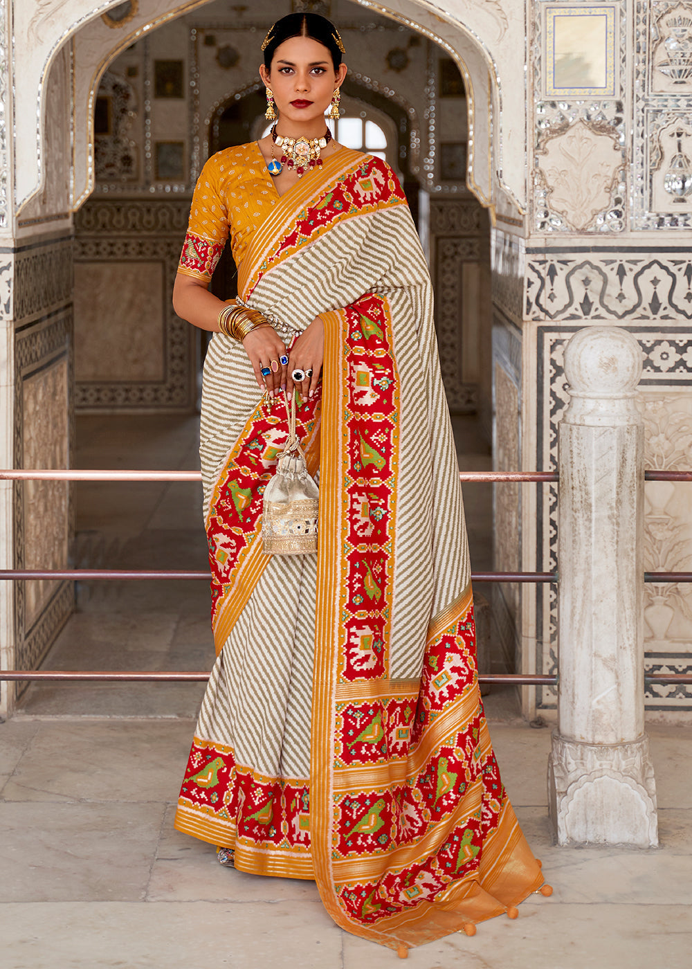 Cameo White and Orange Cotton Patola Printed Saree