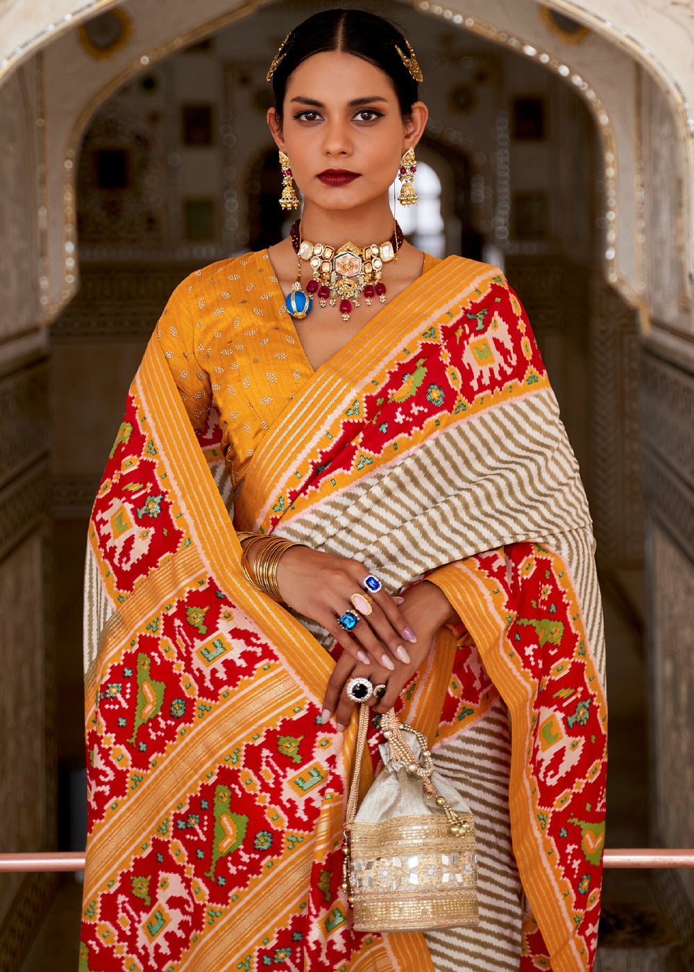 Cameo White and Orange Cotton Patola Printed Saree