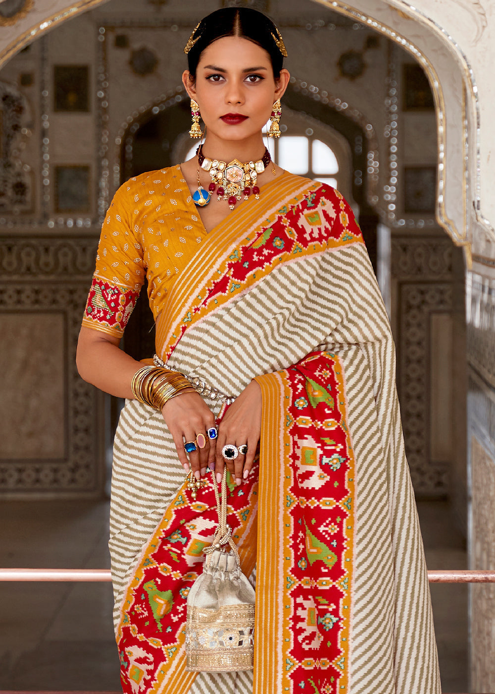 Cameo White and Orange Cotton Patola Printed Saree