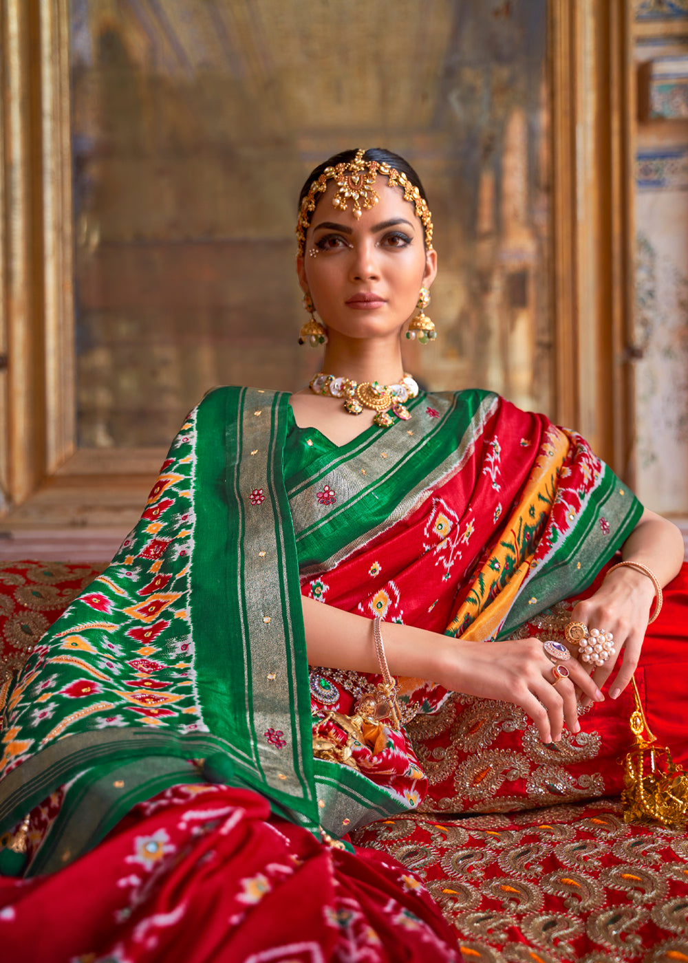 Mahogany Red and Green Woven Patola Silk Saree