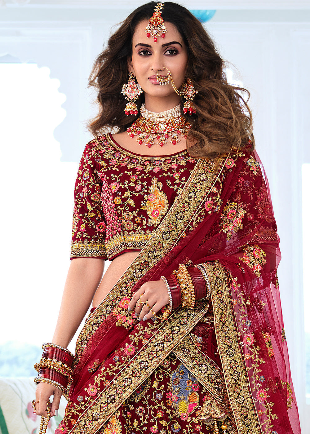 Burnt Umber Maroon Heavy Embroidered Velvet Lehenga