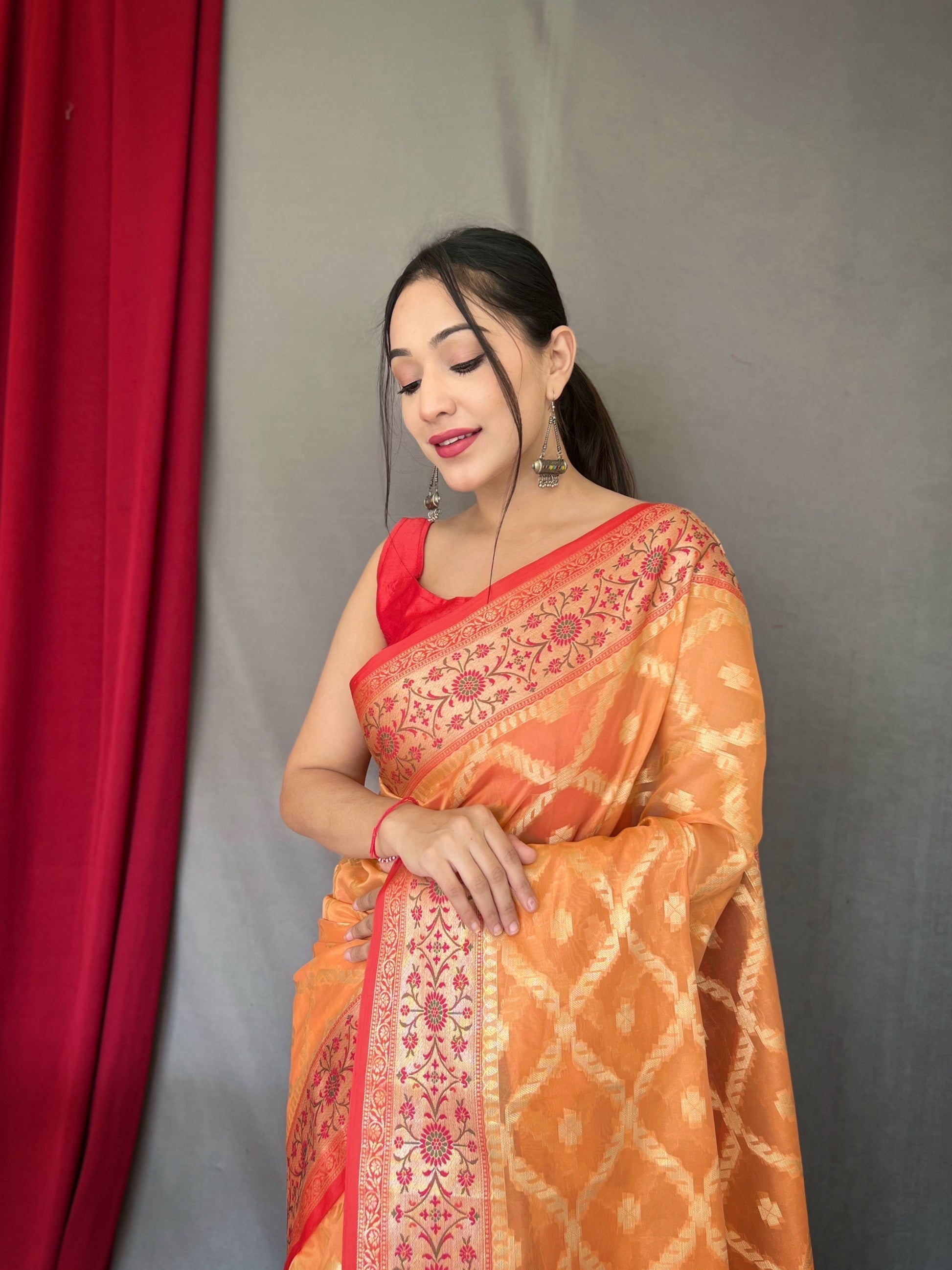 Koromiko Orange Woven Banarasi Organza Silk Saree