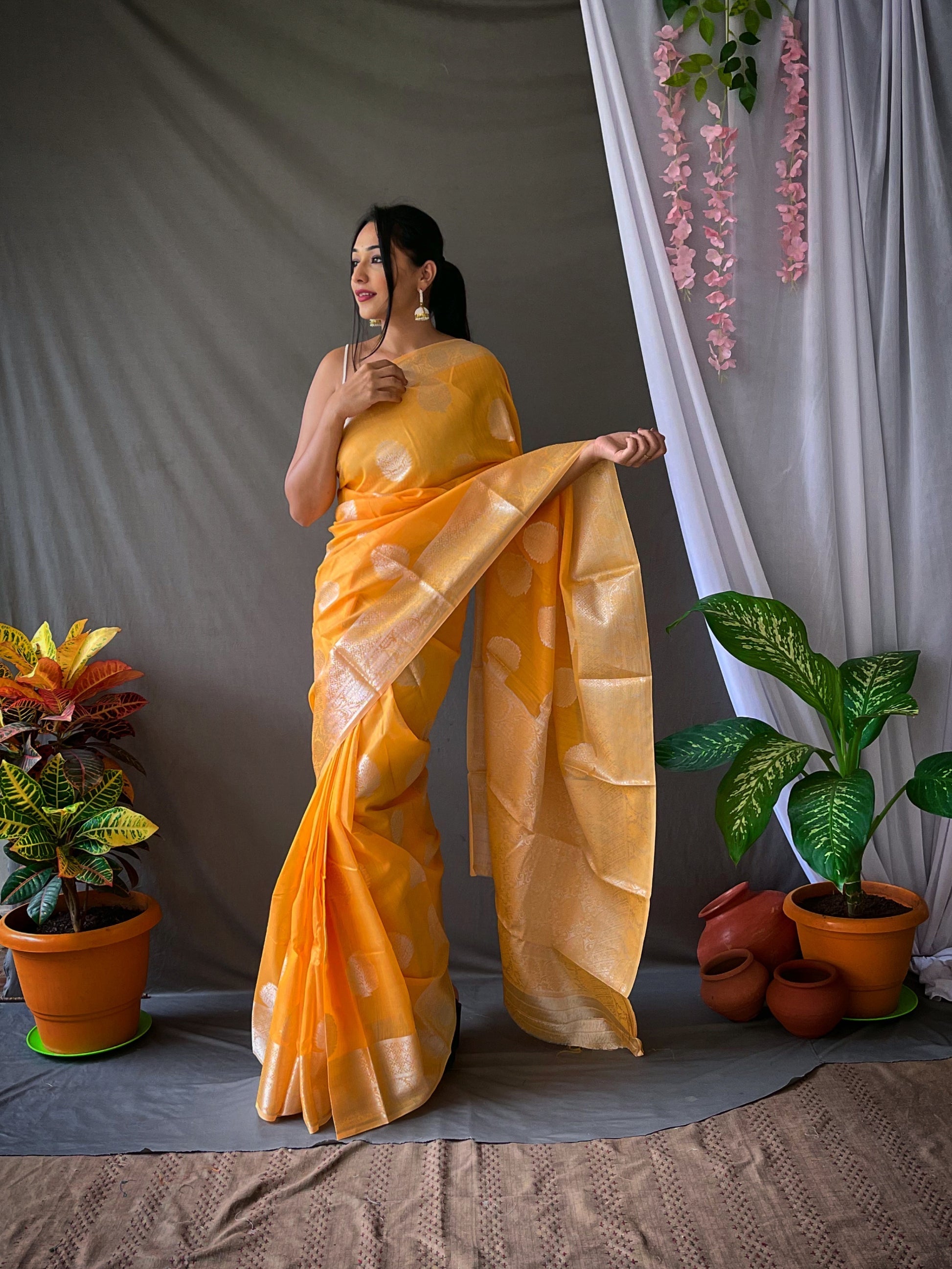 Tainoi Orange Linen Silver Zari Woven Saree