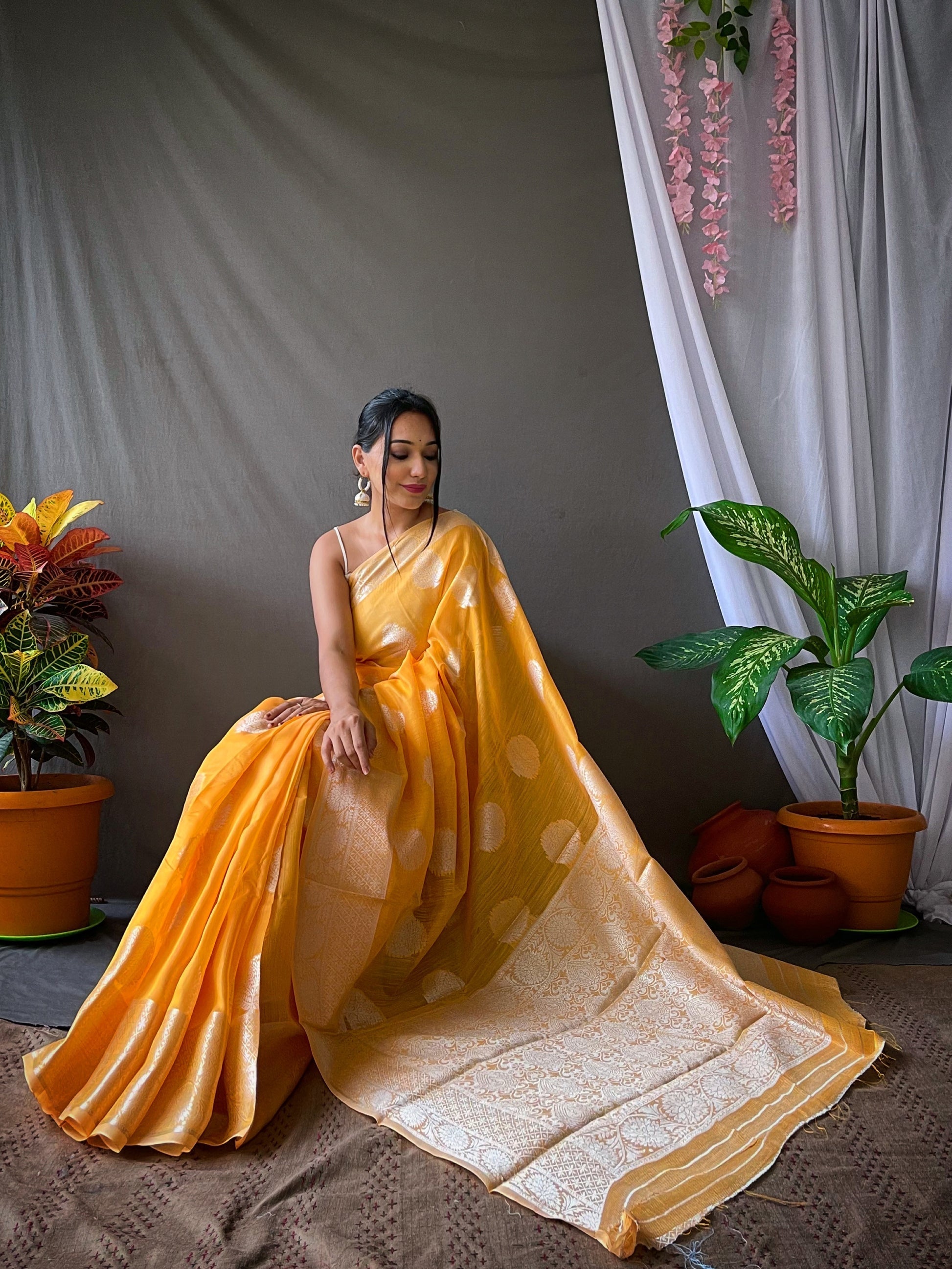 Tainoi Orange Linen Silver Zari Woven Saree