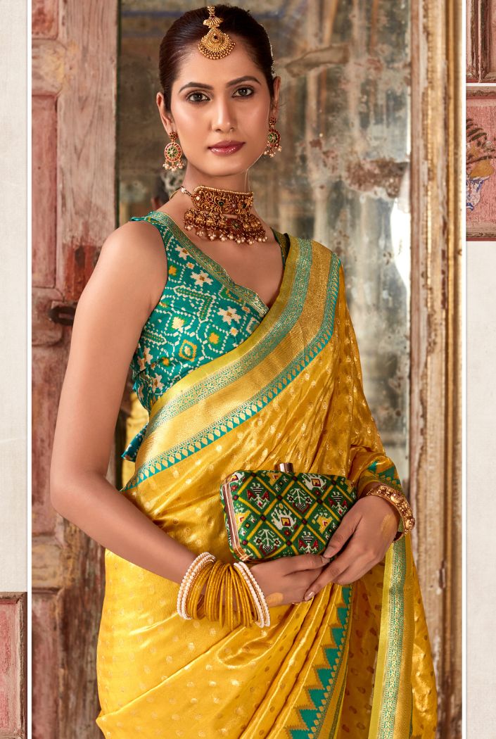 Saffron Yellow Woven Zari Banarasi Patola Silk Saree