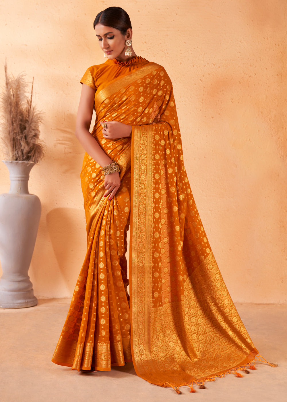 Brandy Punch Yellow Woven Georgette Saree