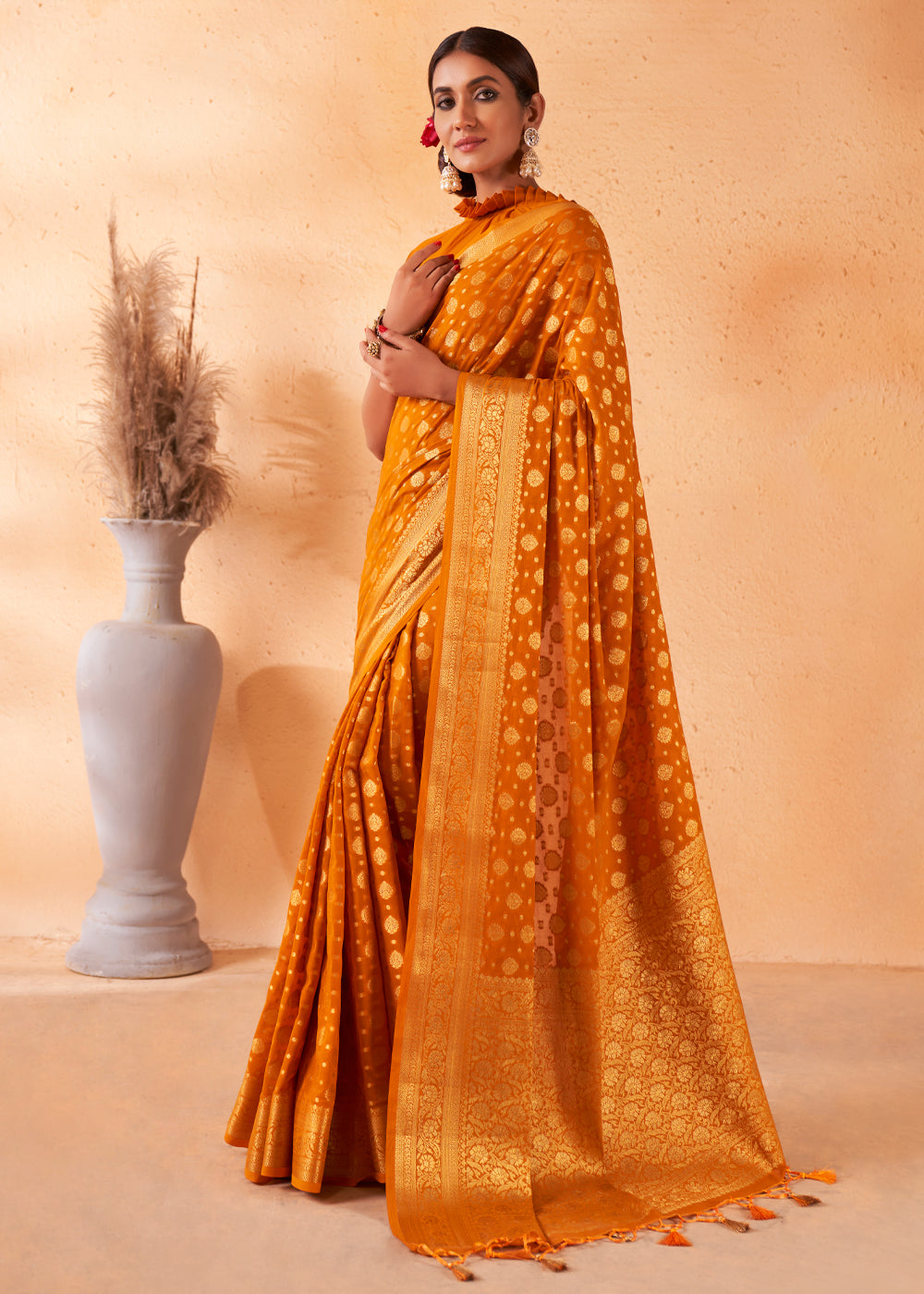 Brandy Punch Yellow Woven Georgette Saree