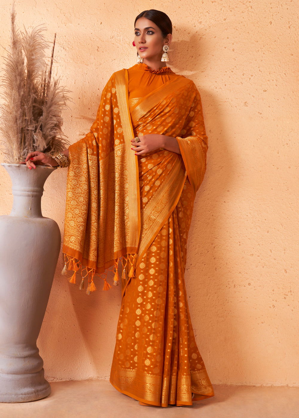 Brandy Punch Yellow Woven Georgette Saree