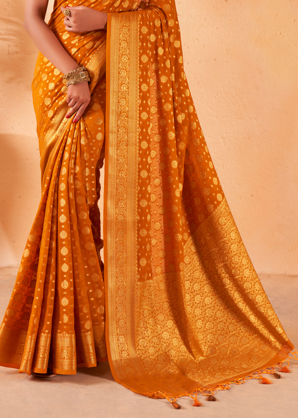 Brandy Punch Yellow Woven Georgette Saree