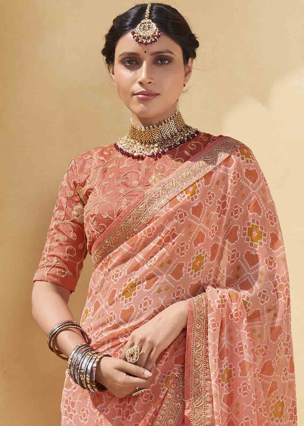 Tonys Peach Patola Print Georgette Saree With Embroidered Blouse