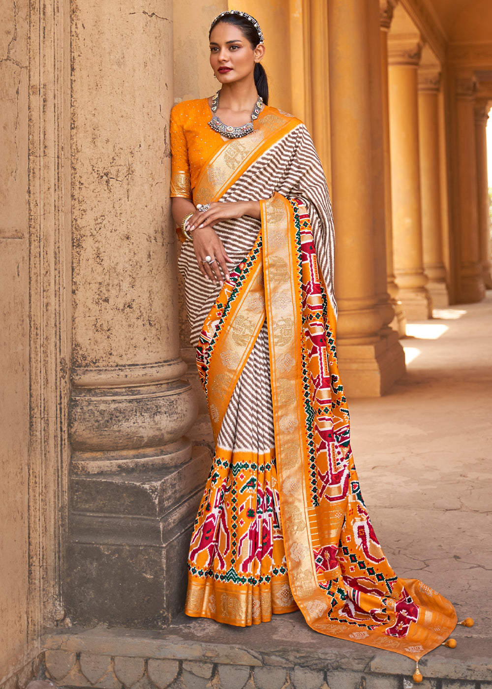 Tango White and Orange Zari Woven Patola Saree