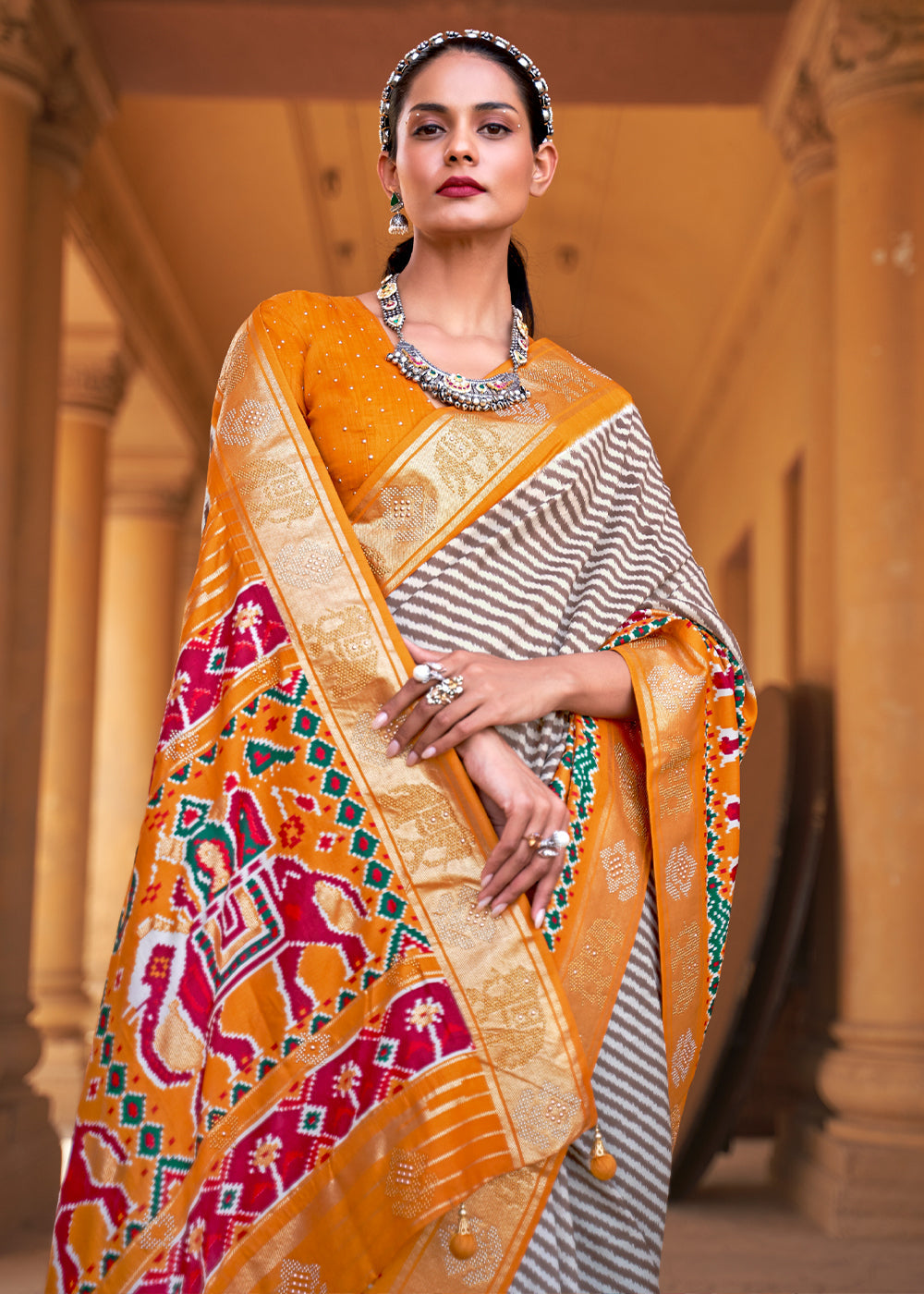 Tango White and Orange Zari Woven Patola Saree