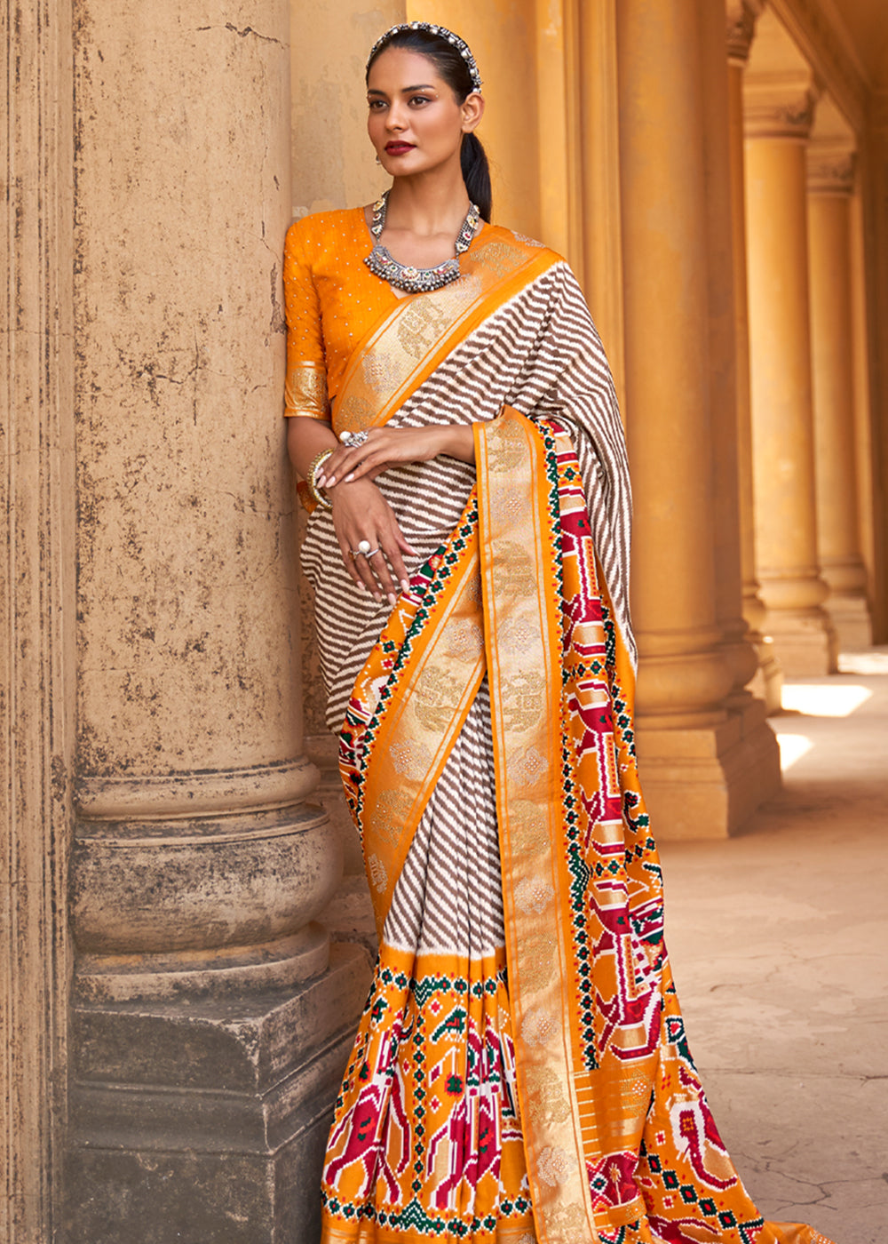 Tango White and Orange Zari Woven Patola Saree