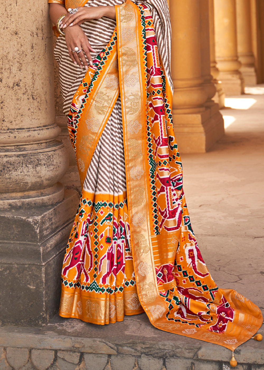 Tango White and Orange Zari Woven Patola Saree