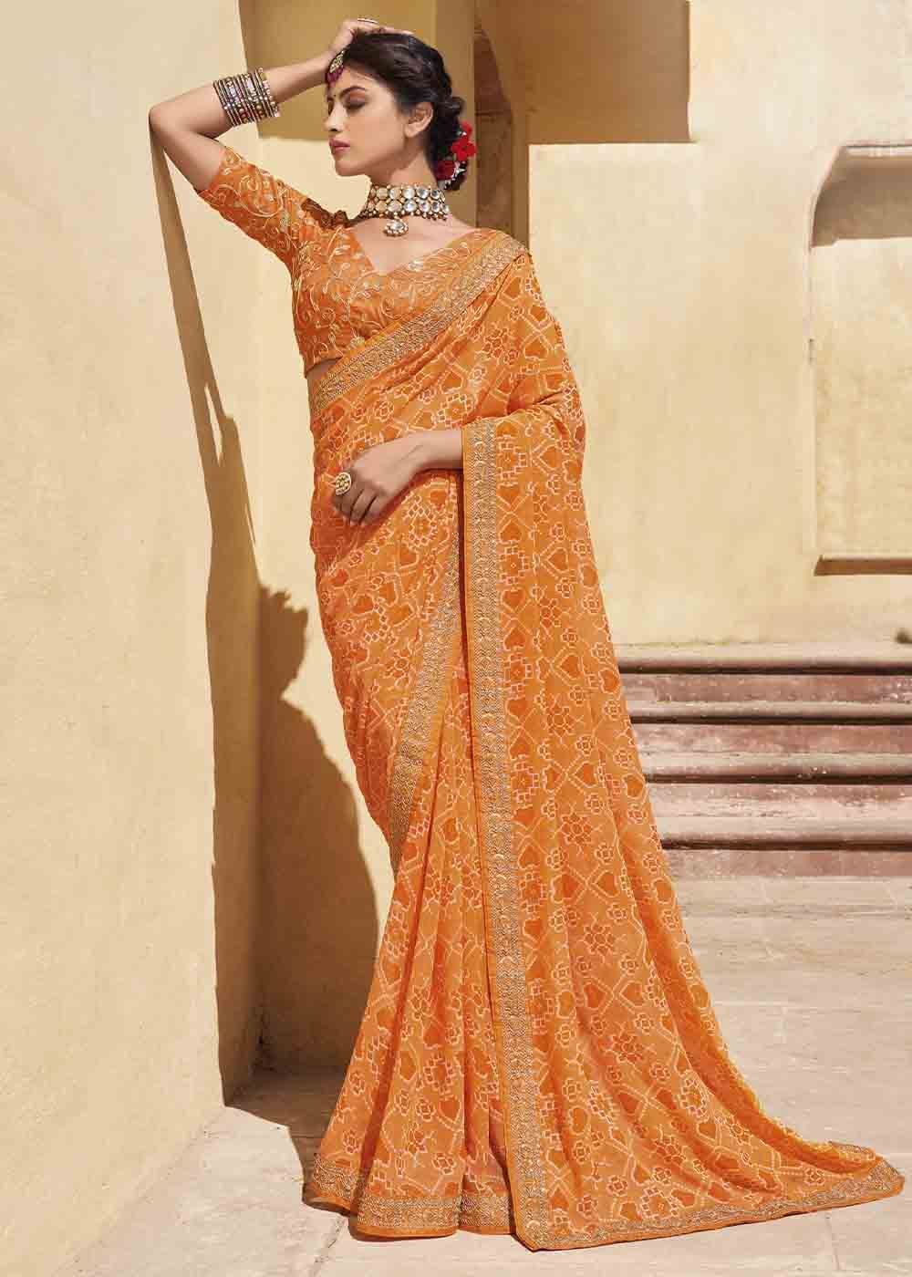 Salomie Orange Patola Print Georgette Saree With Embroidered Blouse