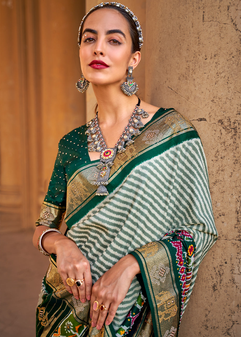 Casal White and Green Zari Woven Patola Saree