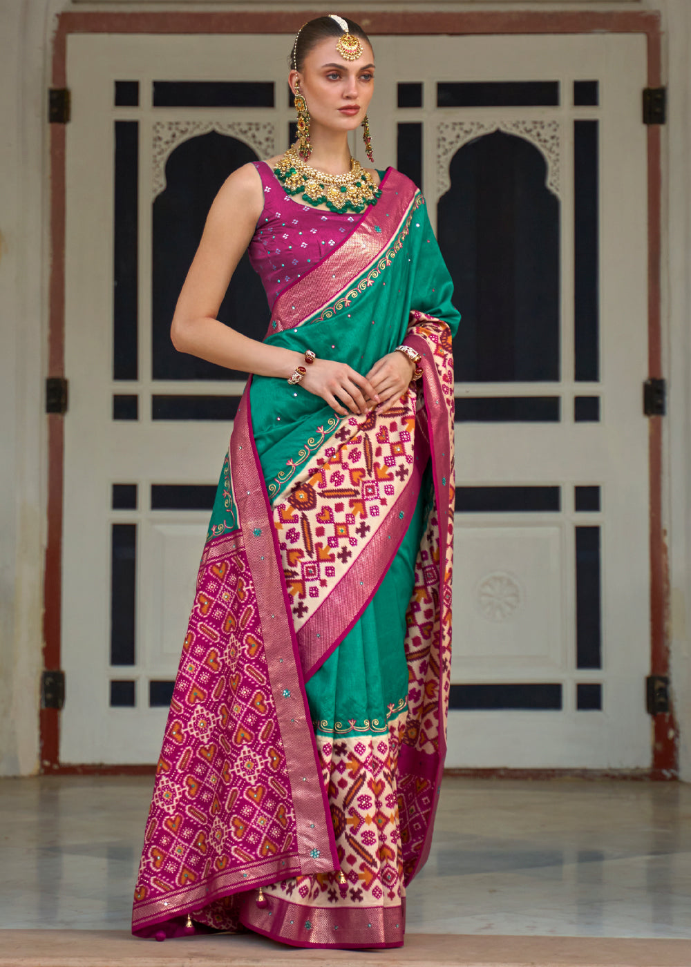 Pine Green and Pink Woven Patola Silk Saree