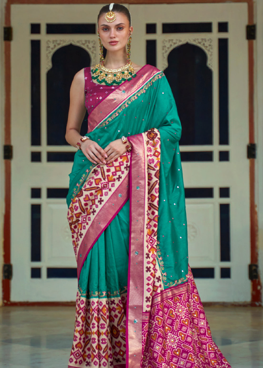 Pine Green and Pink Woven Patola Silk Saree