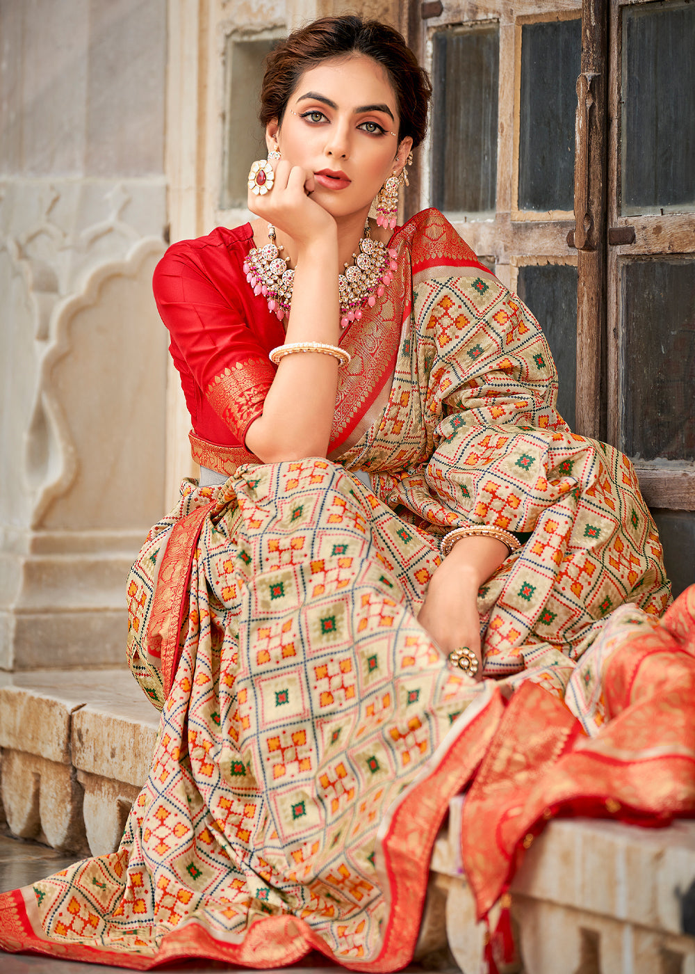 Apricot Cream and Red Zari Woven Patola Saree