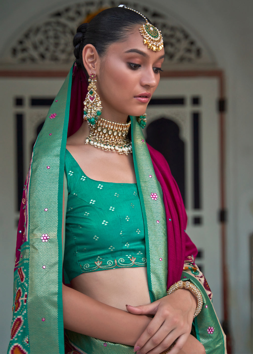 Camelot Dark Pink and Green Woven Patola Silk Saree