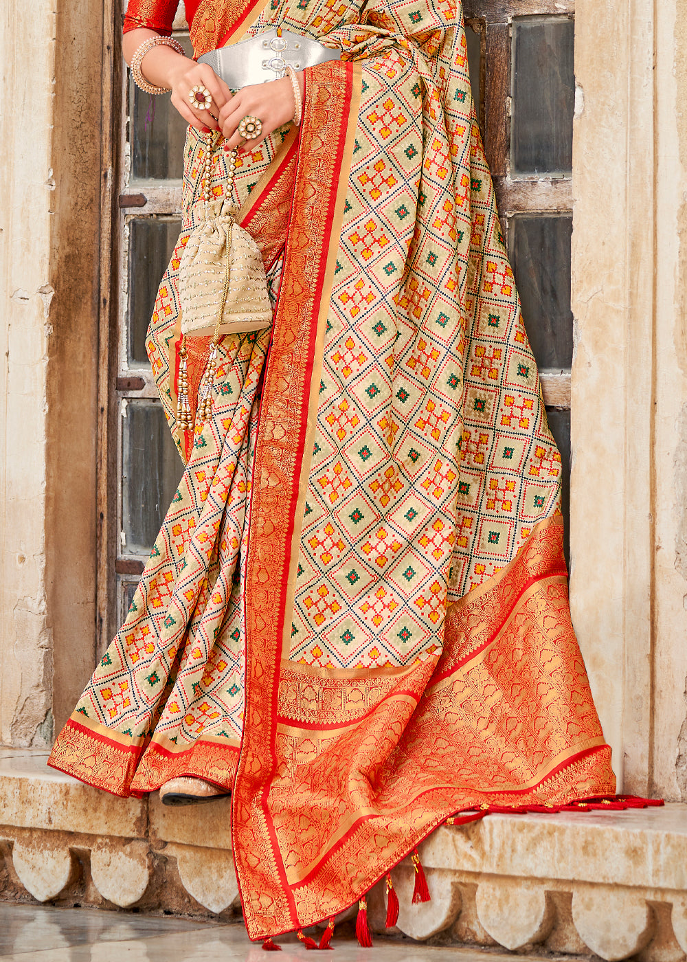 Apricot Cream and Red Zari Woven Patola Saree