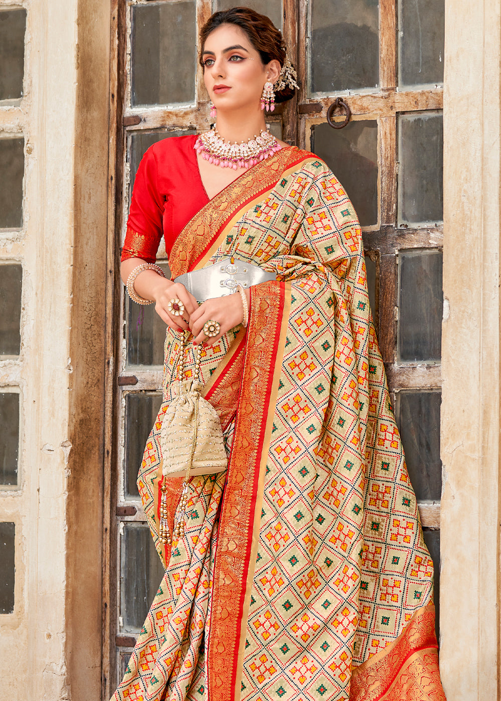 Apricot Cream and Red Zari Woven Patola Saree