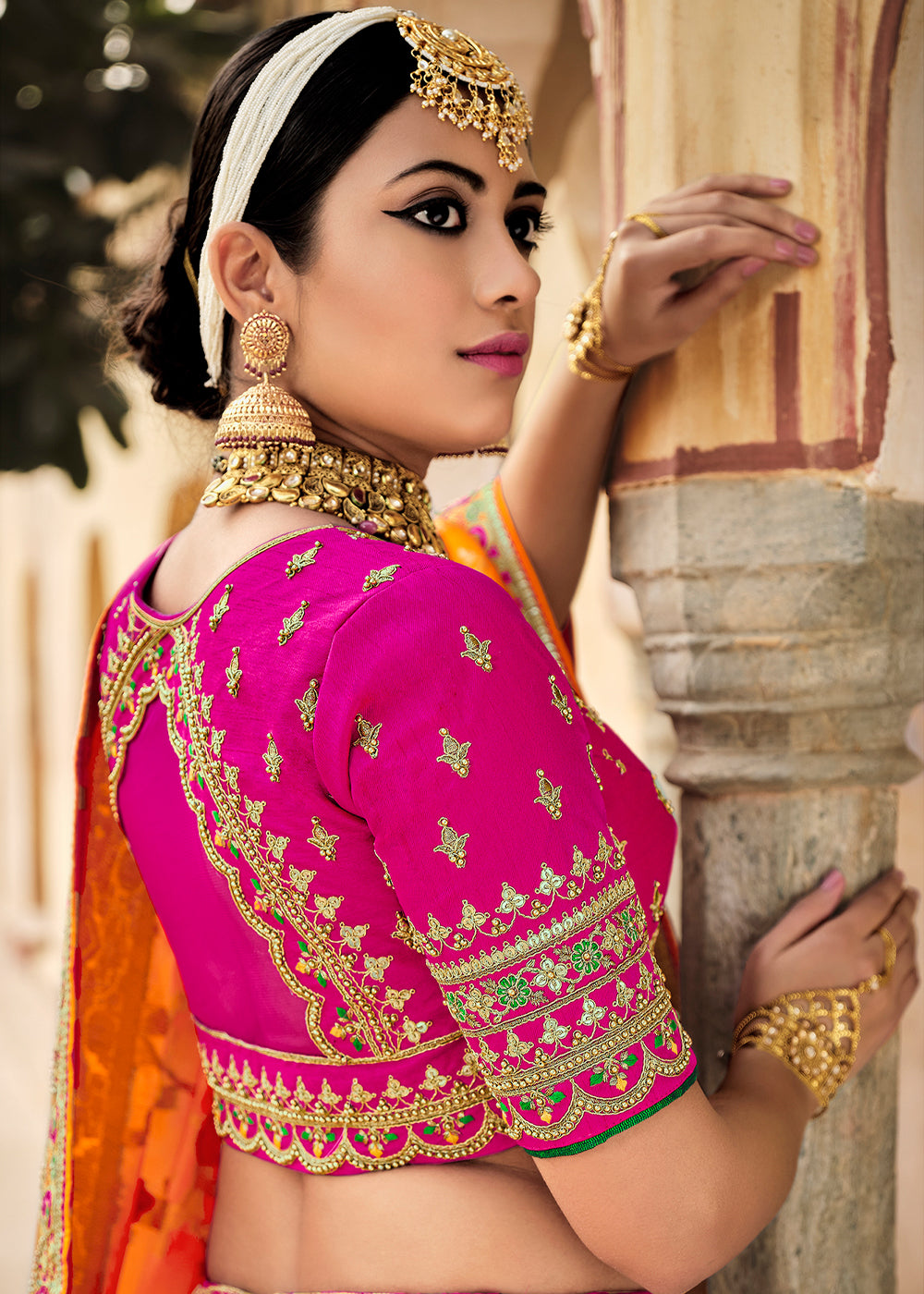 Cranberry Pink and Orange Heavy Embroidered Lehenga